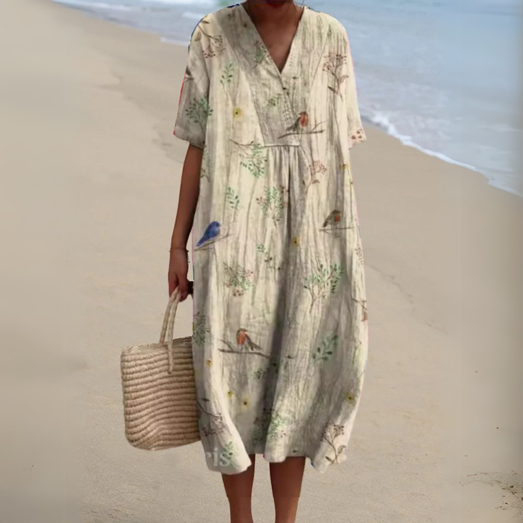 Robe fleurie élégante Nathalie de Danoir Paris, robe longue avec motif floral, tissu fluide et style sophistiqué.