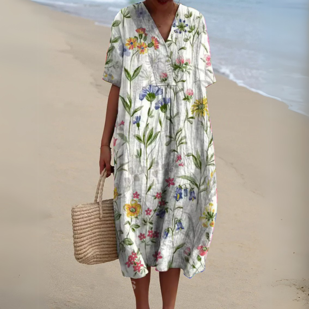 Robe fleurie élégante Nathalie de Danoir Paris, robe longue à motifs floraux pour femme, look sophistiqué et féminin.