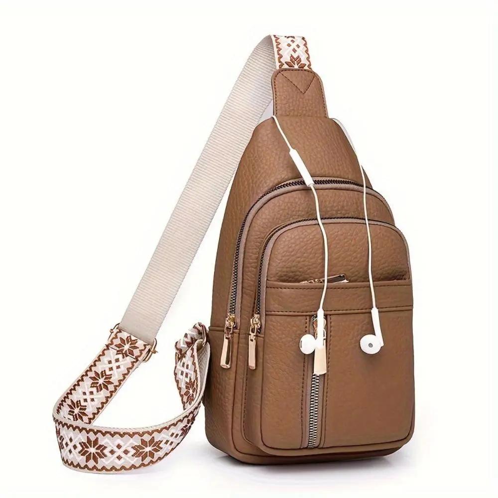 Sac à bandoulière Fiona de Danoir Paris avec roulettes en kaki, design pratique et élégant pour voyager et transporter facilement.