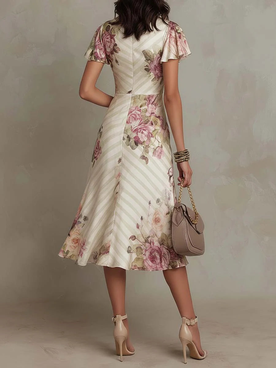 Robe midi en satin floral élégante de Danoir Paris, style rétro, couleur blanche, portée décontractée ou habillée.