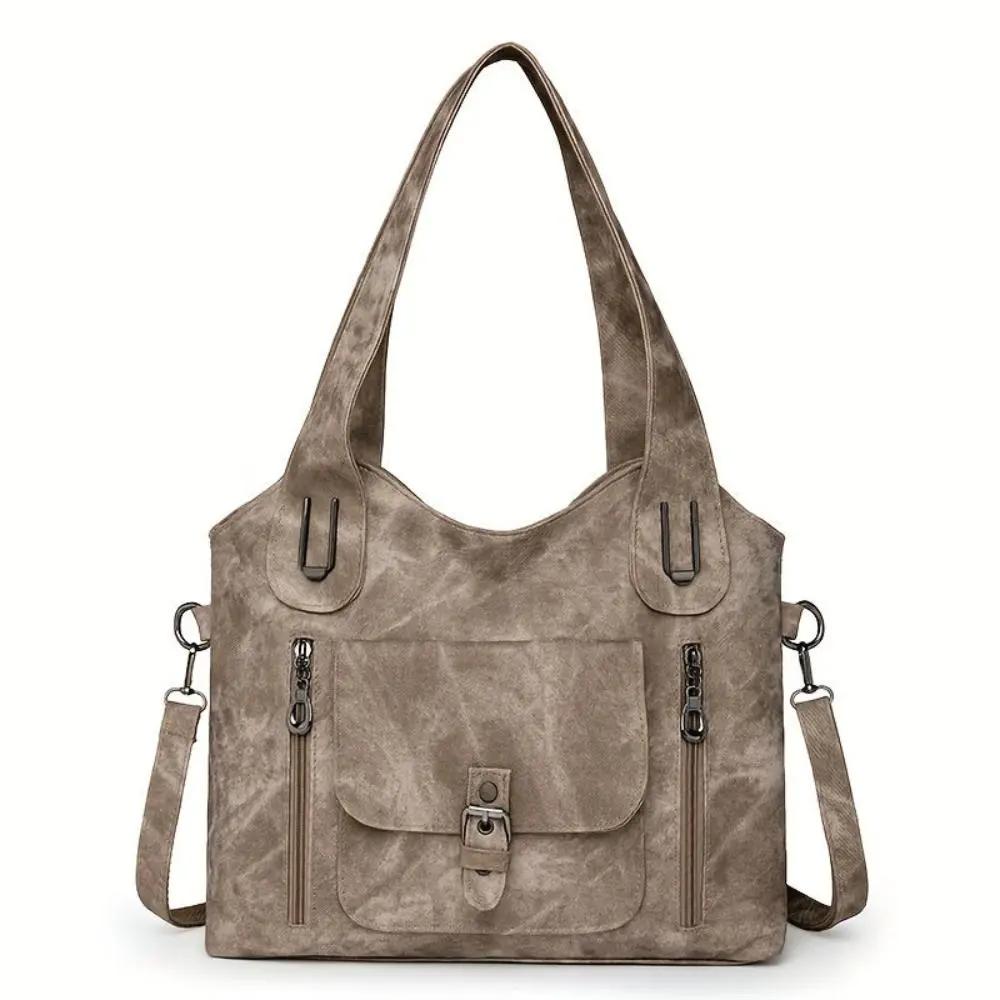 Sac à bandoulière Cecilia en cuir marron de Danoir Paris, élégance intemporelle, avec poignées et fermeture métallique visible.
