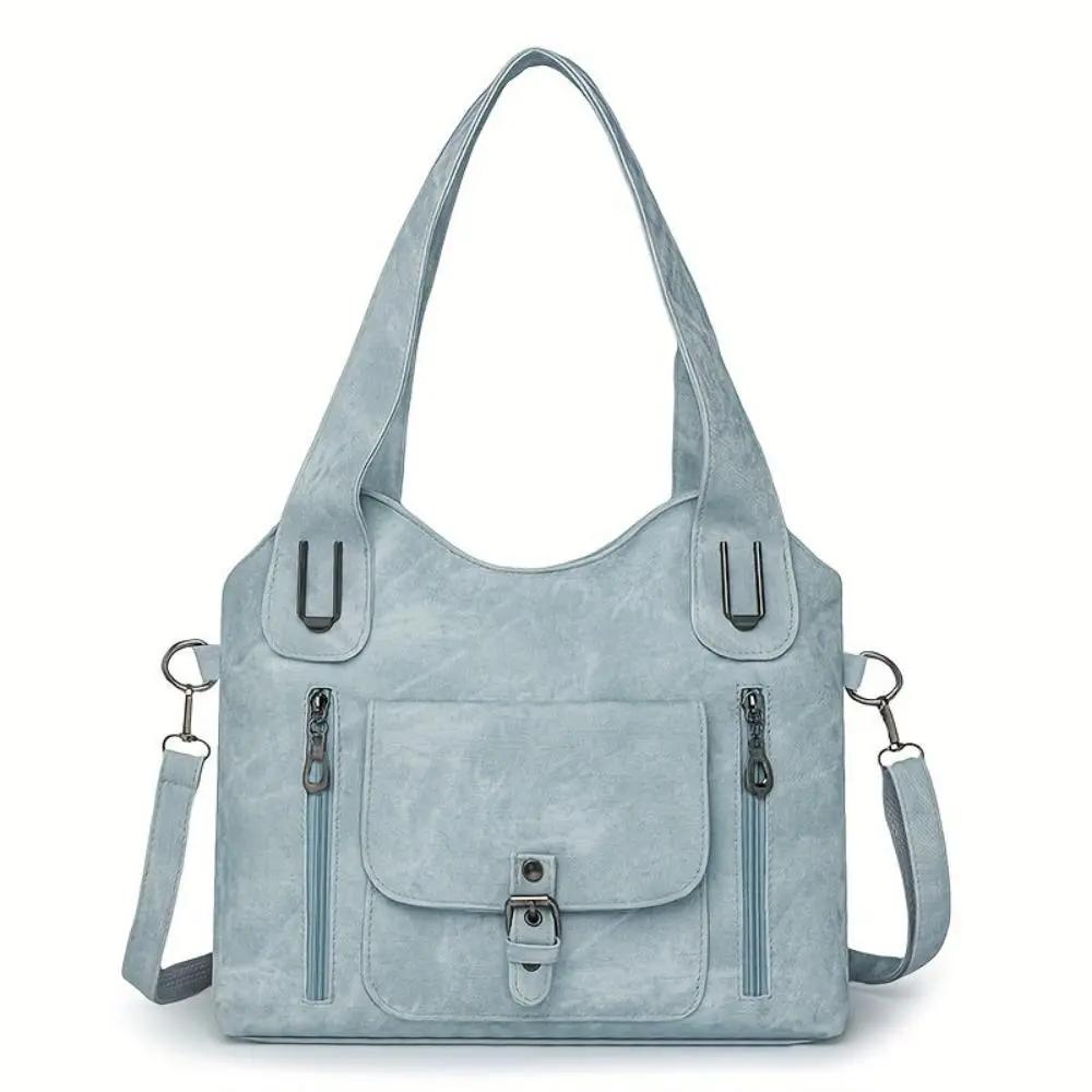 Sac à bandoulière Cecilia de Danoir Paris en cuir marron, élégant et intemporel, avec poignées et détails sophistiqués