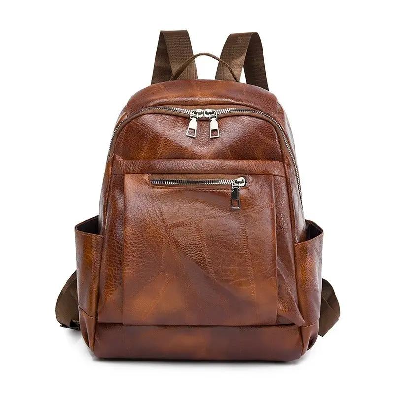 Sac à dos Cordelia de Danoir Paris en marron, élégant et intemporel, avec poignées en cuir et design chic.