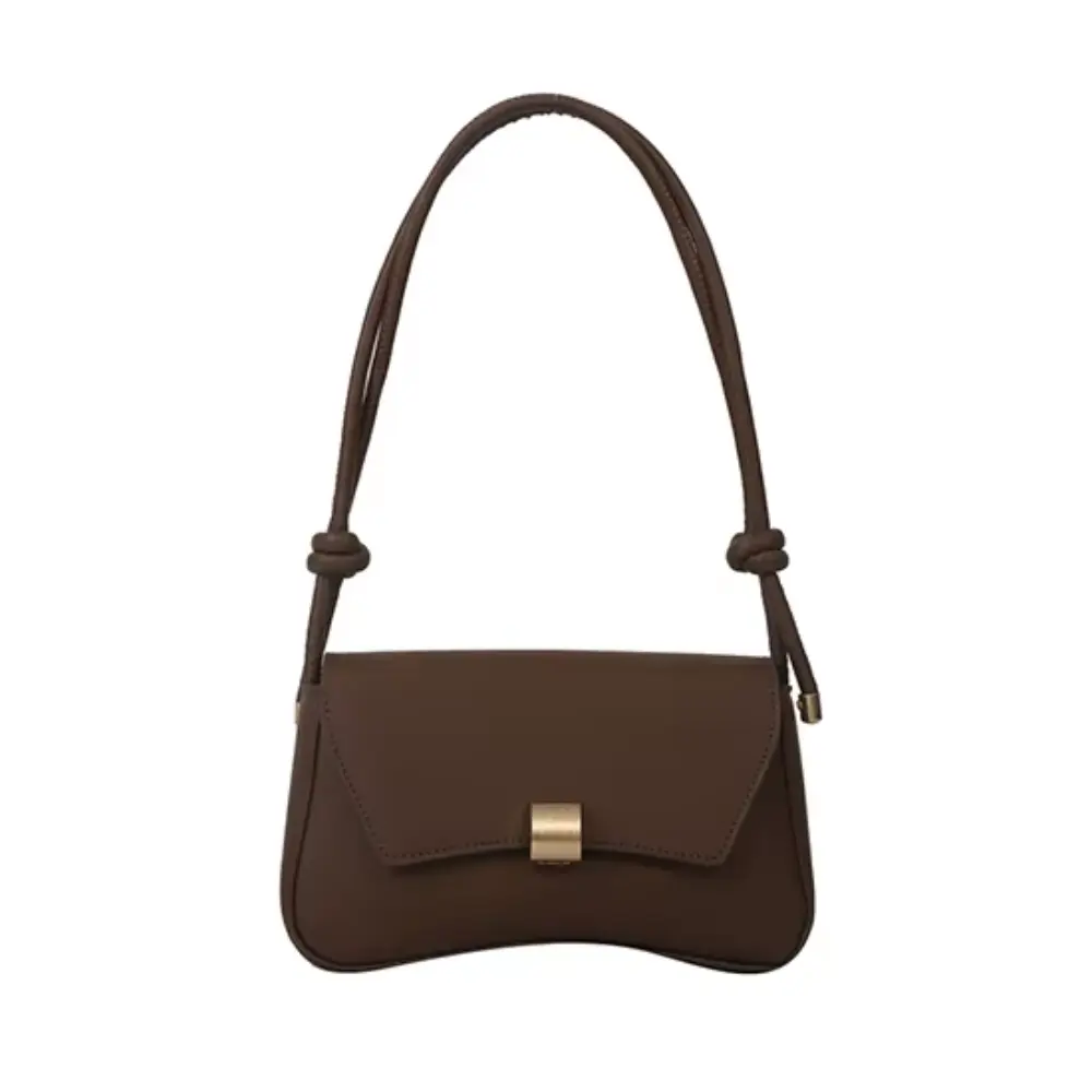 Sac à bandoulière Danoir Paris Daphne en cuir marron, style vintage, avec poches et détails élégants.