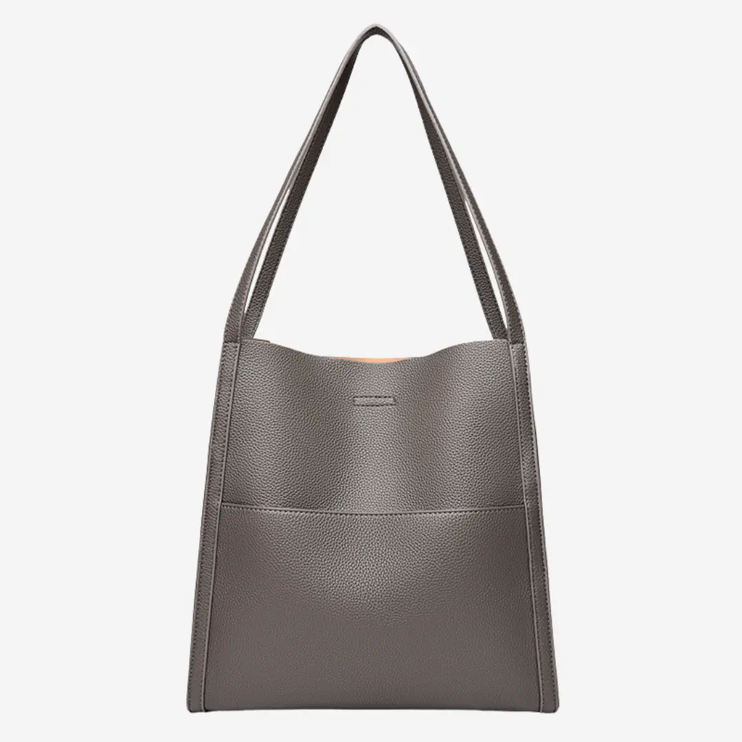 Sac à main en cuir marron Elise de Danoir Paris, élégant accessoire de mode avec poignée et fermeture métallique visible.