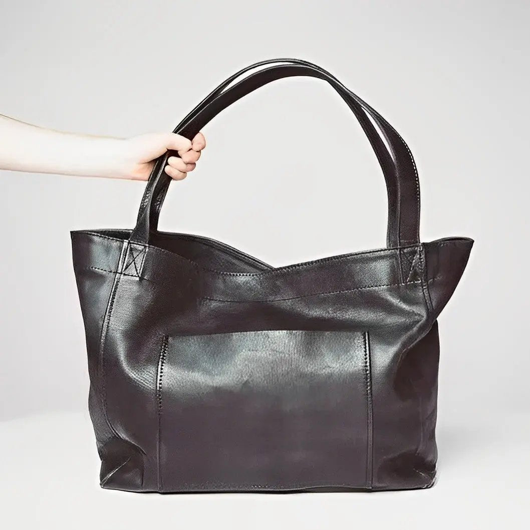 Sac en cuir rétro Élise de Danoir Paris, sac à main marron avec détails élégants, idéal pour un style vintage sophistiqué.