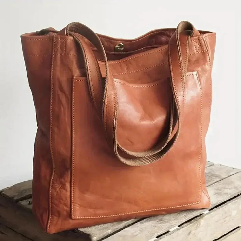 Sac de ville élégant Lila de Danoir Paris en marron, avec poches et poignées en cuir pour un style sophistiqué.