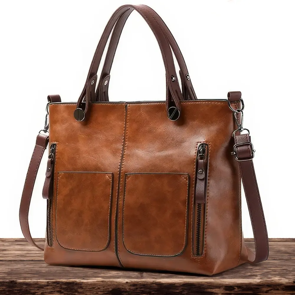 Sac à bandoulière classique Lilia de Danoir Paris en cuir marron, élégant et pratique pour un style sophistiqué.