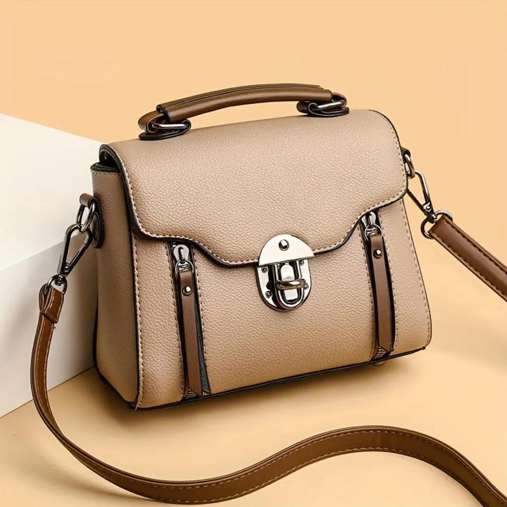 Sac à main rétro-chic Luna de Danoir Paris en marron, avec poignées et détails élégants, style vintage sophistiqué.