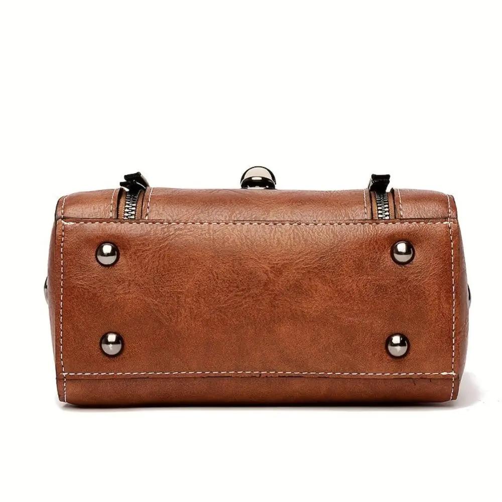 Sac à main rétro-chic Luna de Danoir Paris, en cuir marron, avec poignée élégante et design vintage.