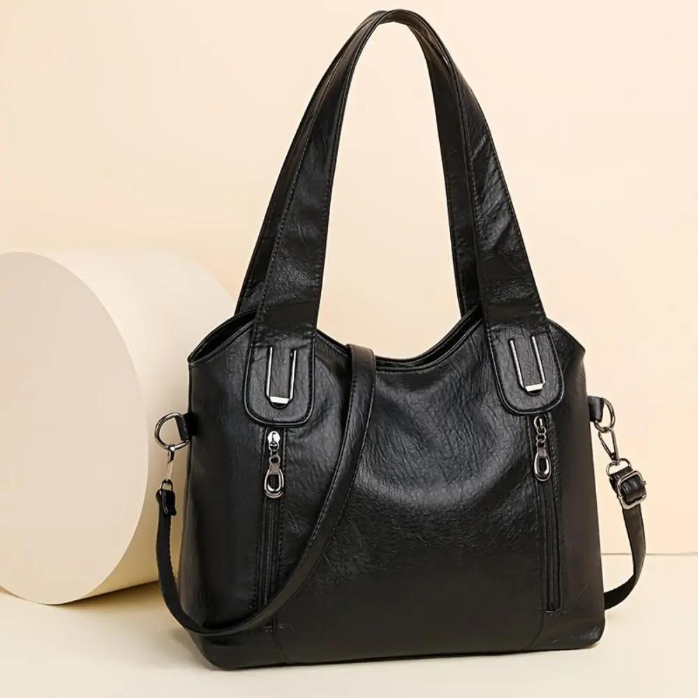 Sac à bandoulière Danoir Paris Lydia en cuir marron avec charme vintage et détails élégants, idéal pour un look sophistiqué.