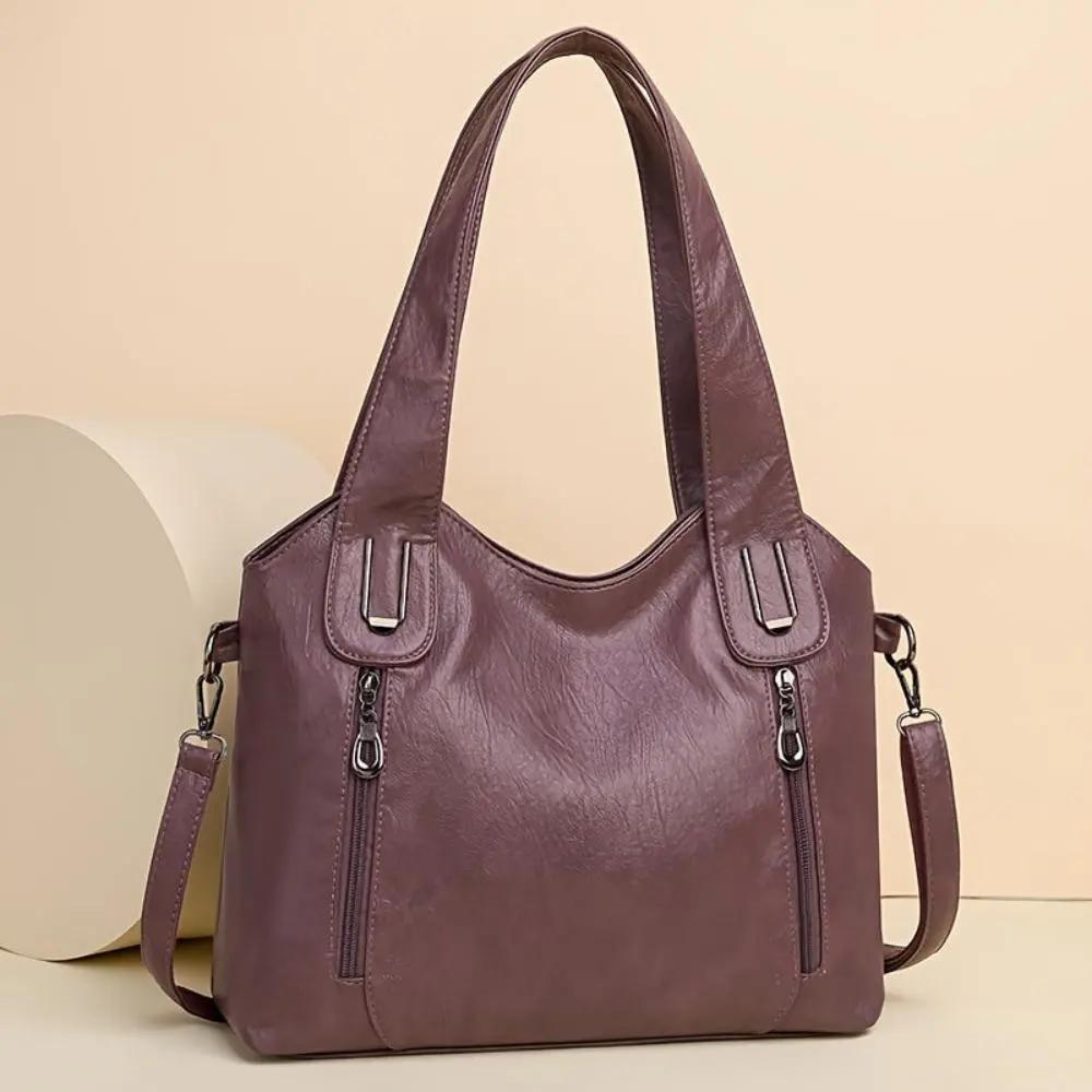 Sac à bandoulière Lydia Danoir Paris en cuir marron avec design vintage, élégant et pratique pour un style rétro.