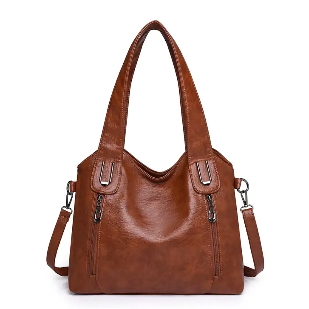 Sac à bandoulière Lydia Danoir Paris en cuir marron avec style vintage, détails élégants et finition raffinée.