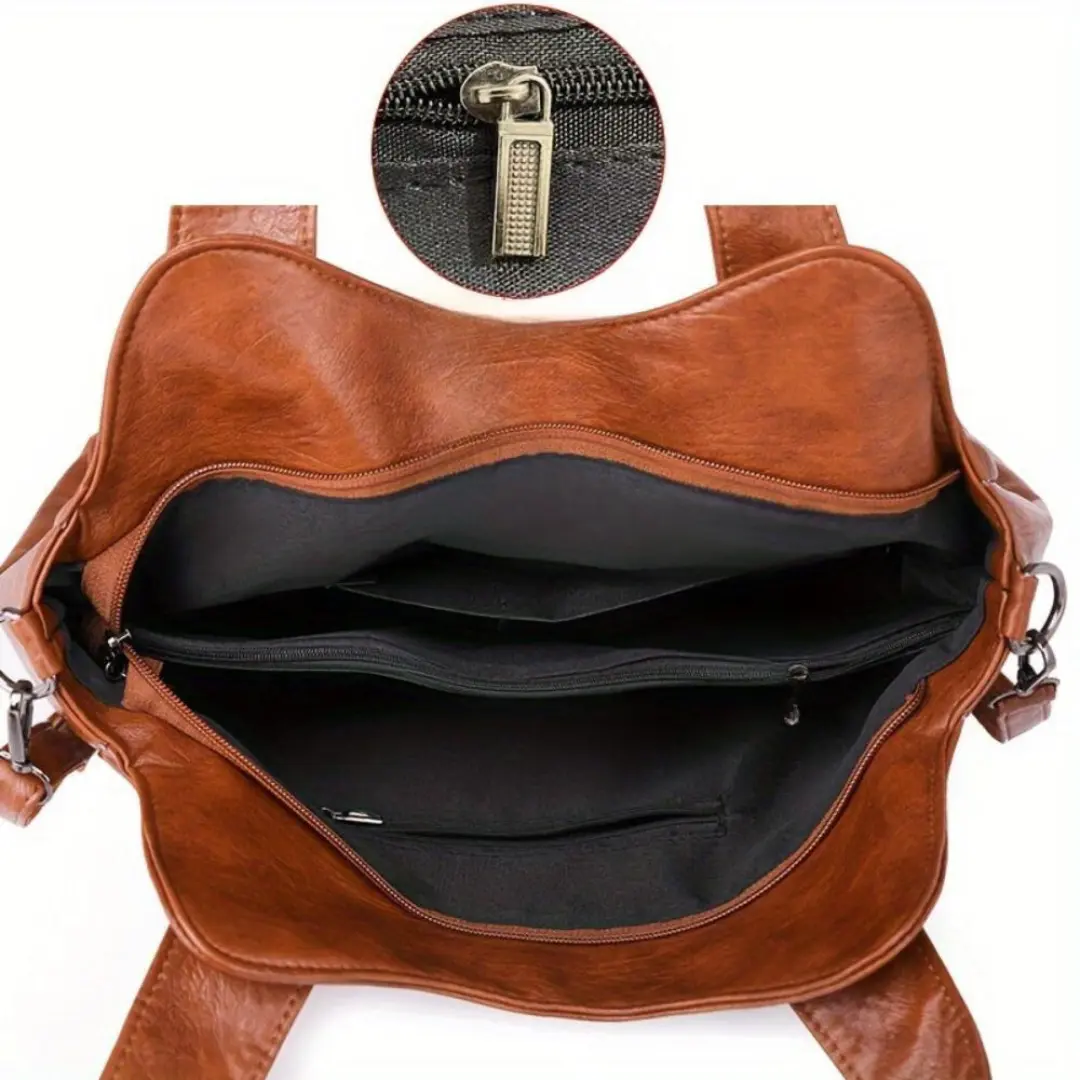 Sac à bandoulière Lydia Danoir Paris en cuir marron avec style vintage, détails élégants et pochette pratique.