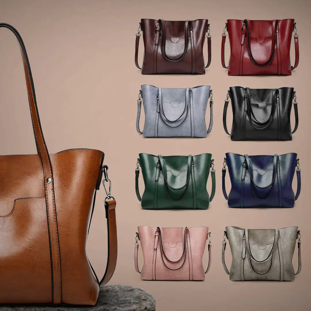 Sac à main élégant Lydia de Danoir Paris en cuir marron, avec poignée et détails sophistiqués.