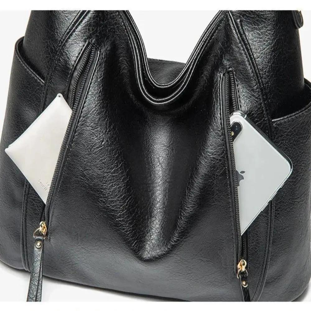 Sac Lylia de Danoir Paris en marron, élégant et intemporel, avec poignées en cuir et design sophistiqué visible dans l'image.