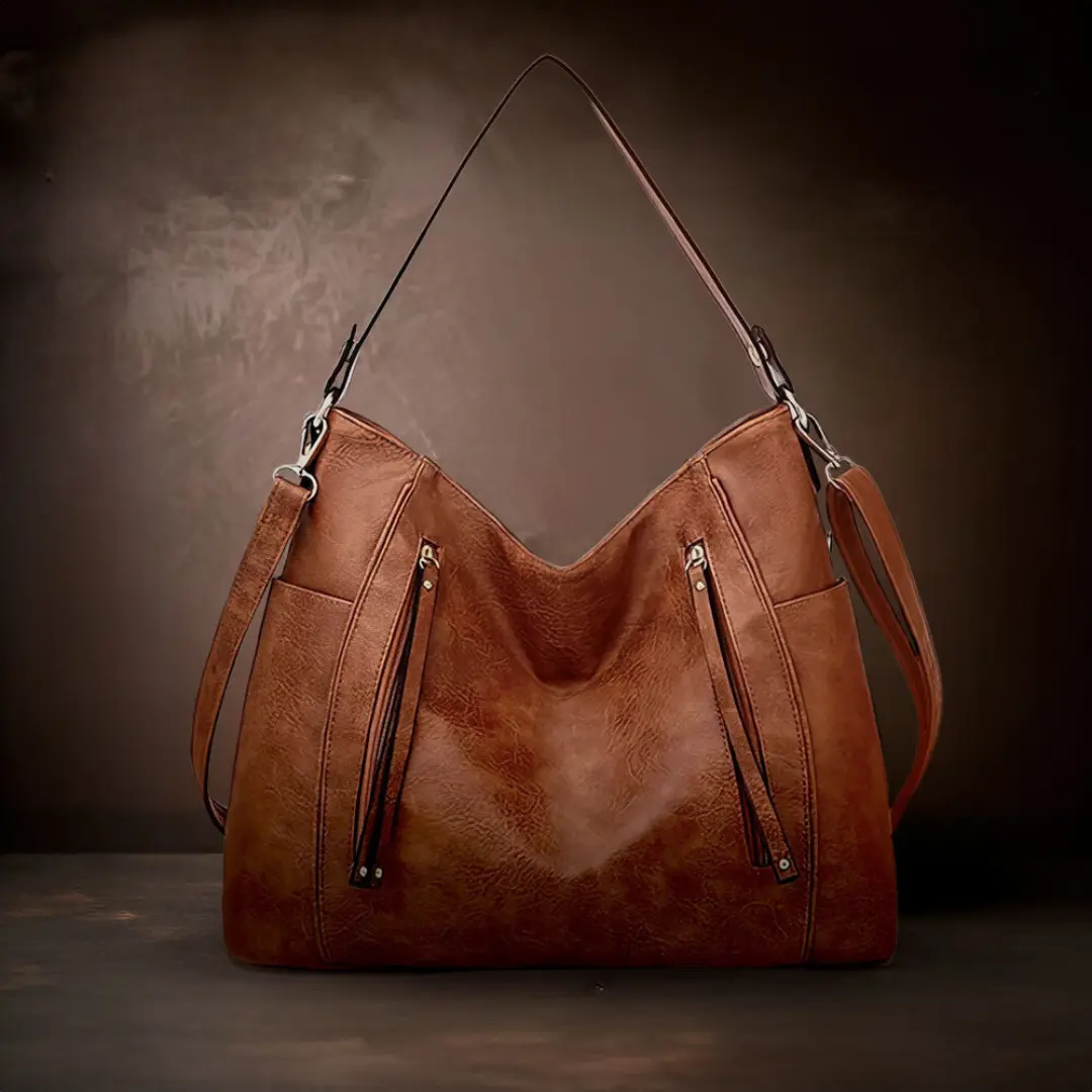 Sac Lylia de Danoir Paris en marron, élégant sac à main intemporel avec finition sophistiquée et poignées confortables.