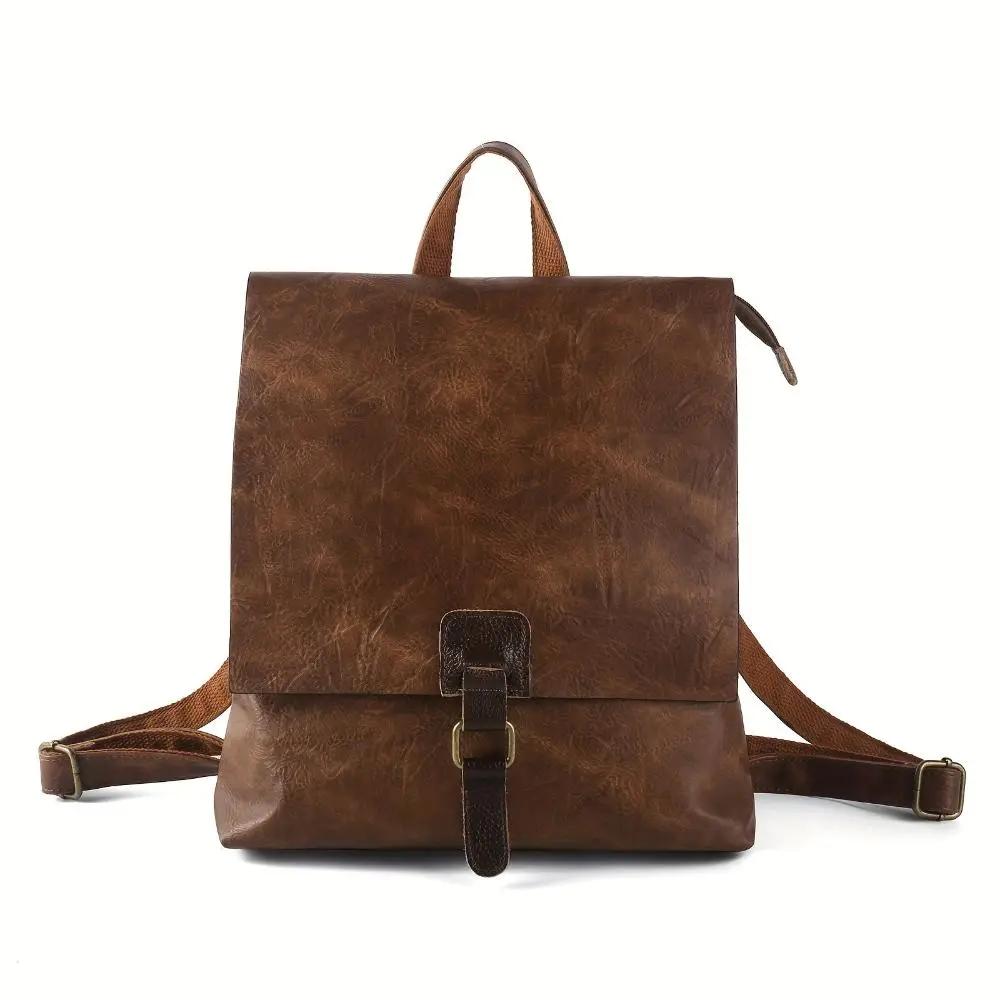 Sac à dos Danoir Paris Nina en cuir marron, style vintage, avec compartiments pratiques et design élégant.