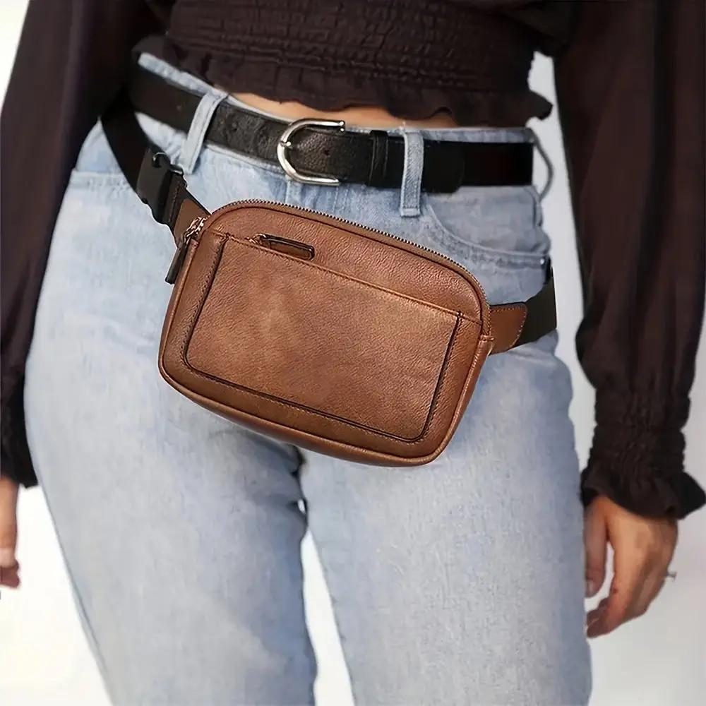 Sac bandoulière Aspen Sport marron de Nina, Danoir Paris, avec poignées et détails élégants.