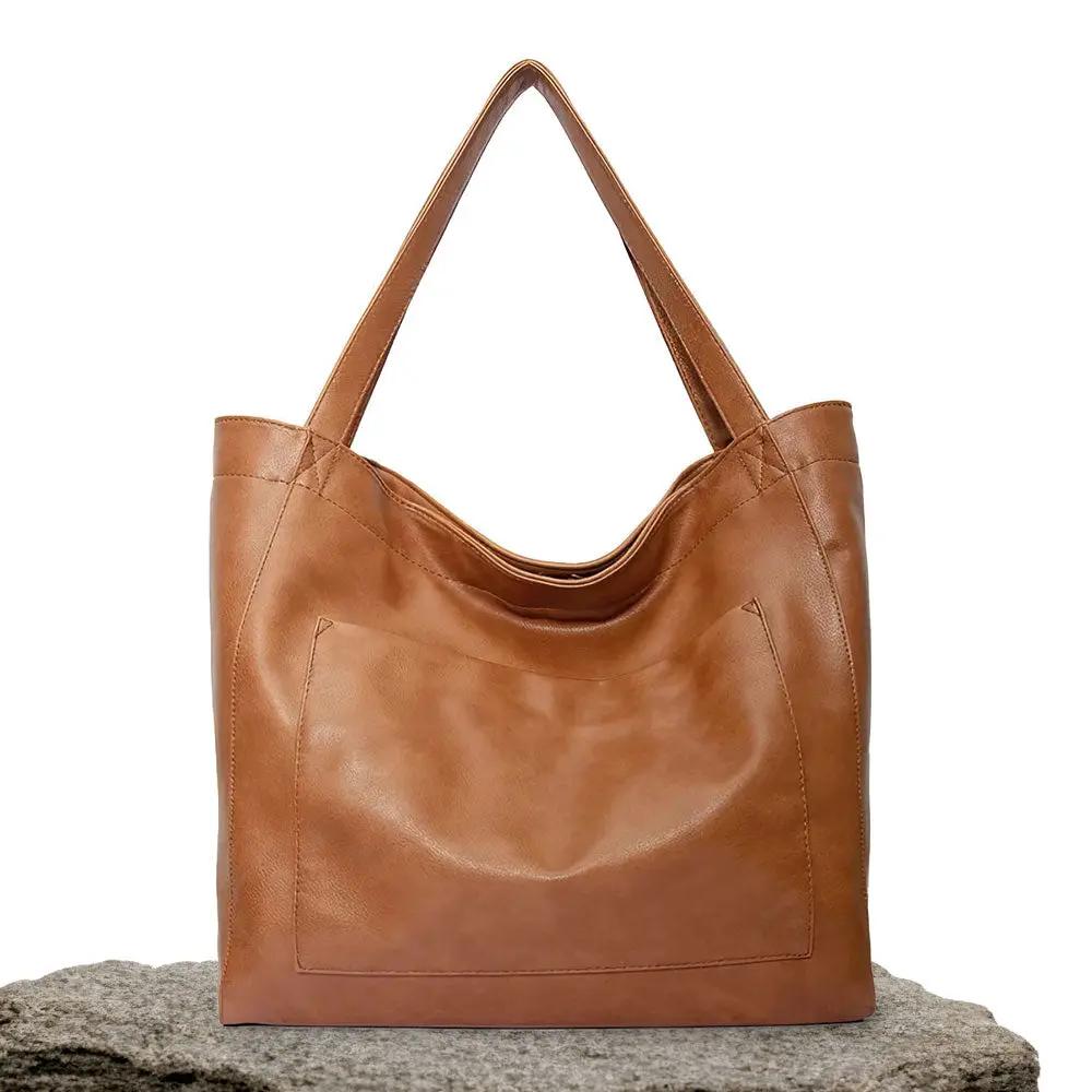 Sac à bandoulière Danoir Paris Ringelblume en matériau doux marron, sac de luxe élégant pour femmes.