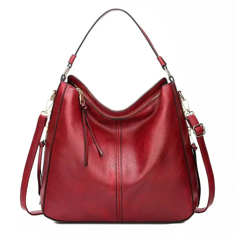 Sac élégant Romy en cuir marron de Danoir Paris, vue de face avec poignées et détails sophistiqués.