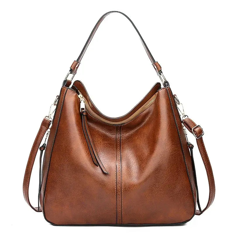 Sac élégant Romy en cuir marron de Danoir Paris, avec poignées et design sophistiqué visible dans l'image.