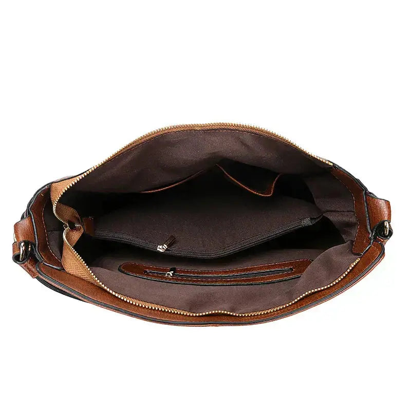 Sac élégant en cuir marron Romy de Danoir Paris, avec poignées et détails sophistiqués pour un look chic et raffiné.