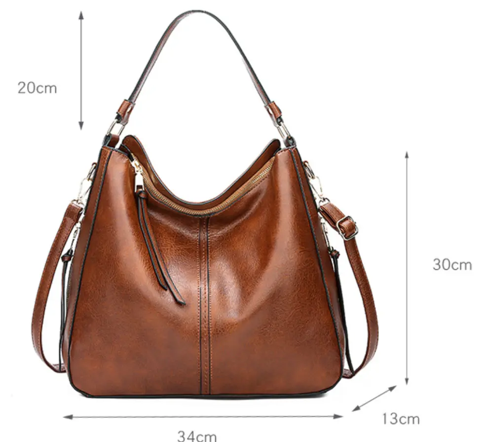 Sac élégant en cuir Romy de Danoir Paris, en cuir marron avec poignées et détails sophistiqués, idéal pour un look chic.