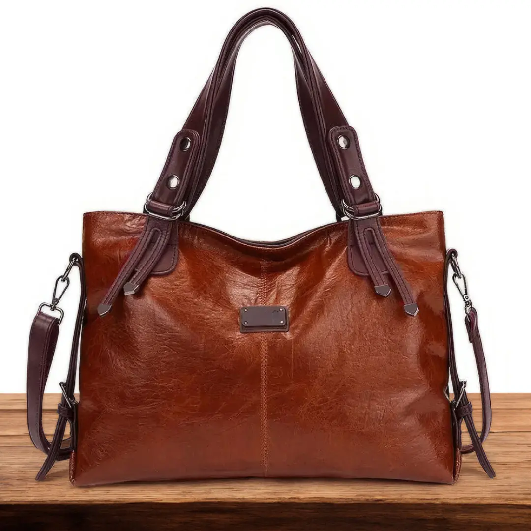 Sac de voyage Sienna de Danoir Paris, valise marron en cuir intemporel avec poignees et compartiments spacieux.