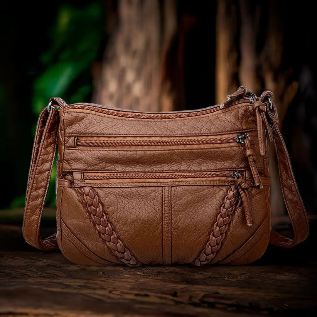 Sac à main marron Danoir Paris Talia, sac d'élégance intemporelle avec poignées en cuir et détails sophistiqués.