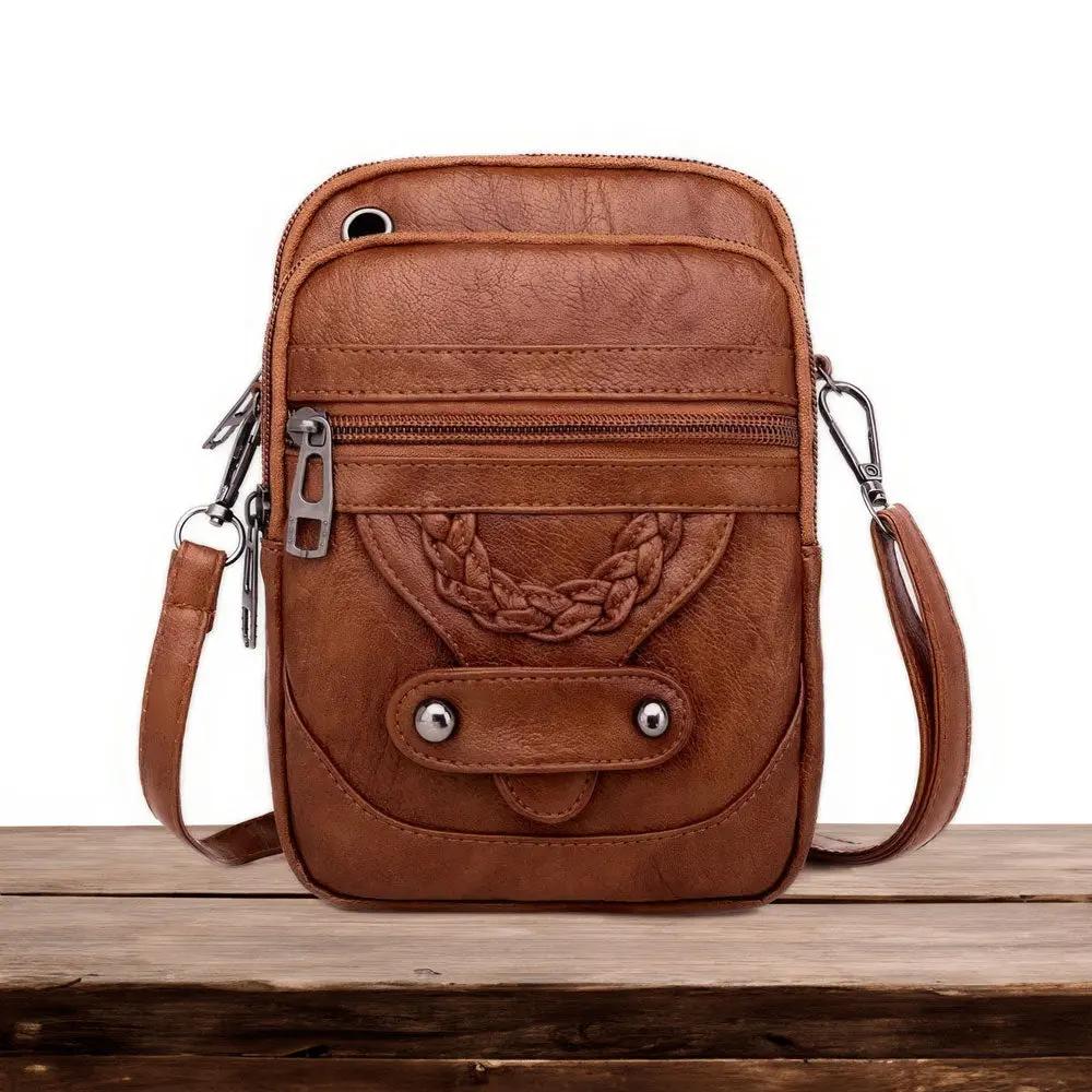 Sac à bandoulière Tamsin de Danoir Paris en marron, élégant et intemporel, avec détails en cuir et design sophistiqué.