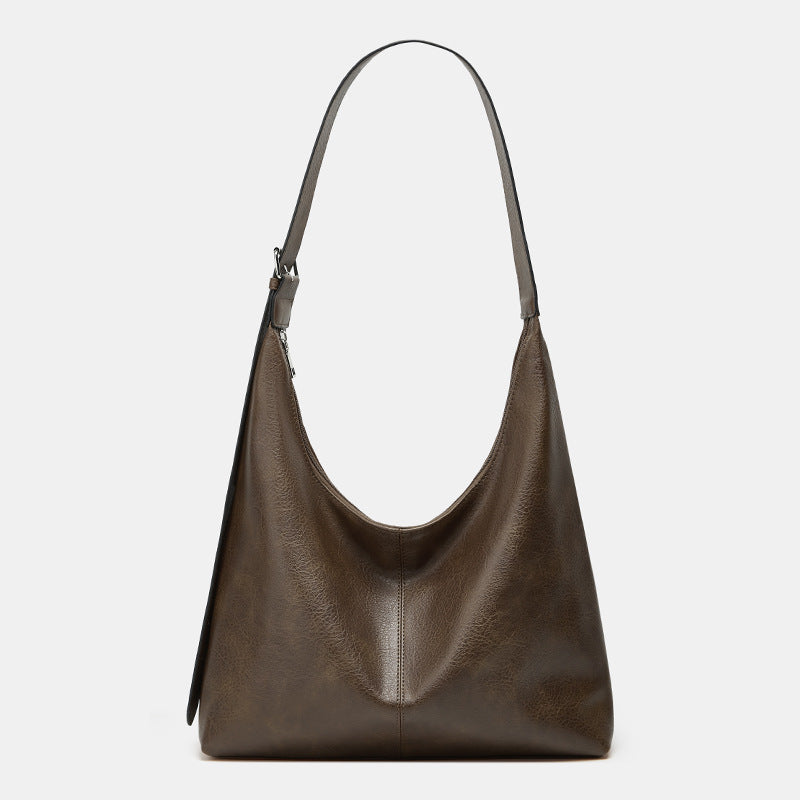Sac à dos Danoir Paris Victoria en marron, grand capacité, idéal pour un usage polyvalent et pratique.