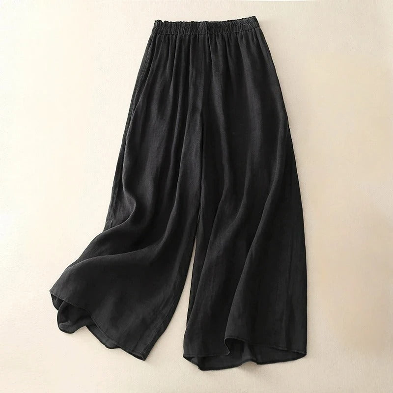 Pantalons en lin marron Nicolé de Danoir Paris, coupe élégante, portée décontractée, vue de face avec ceinture fine.