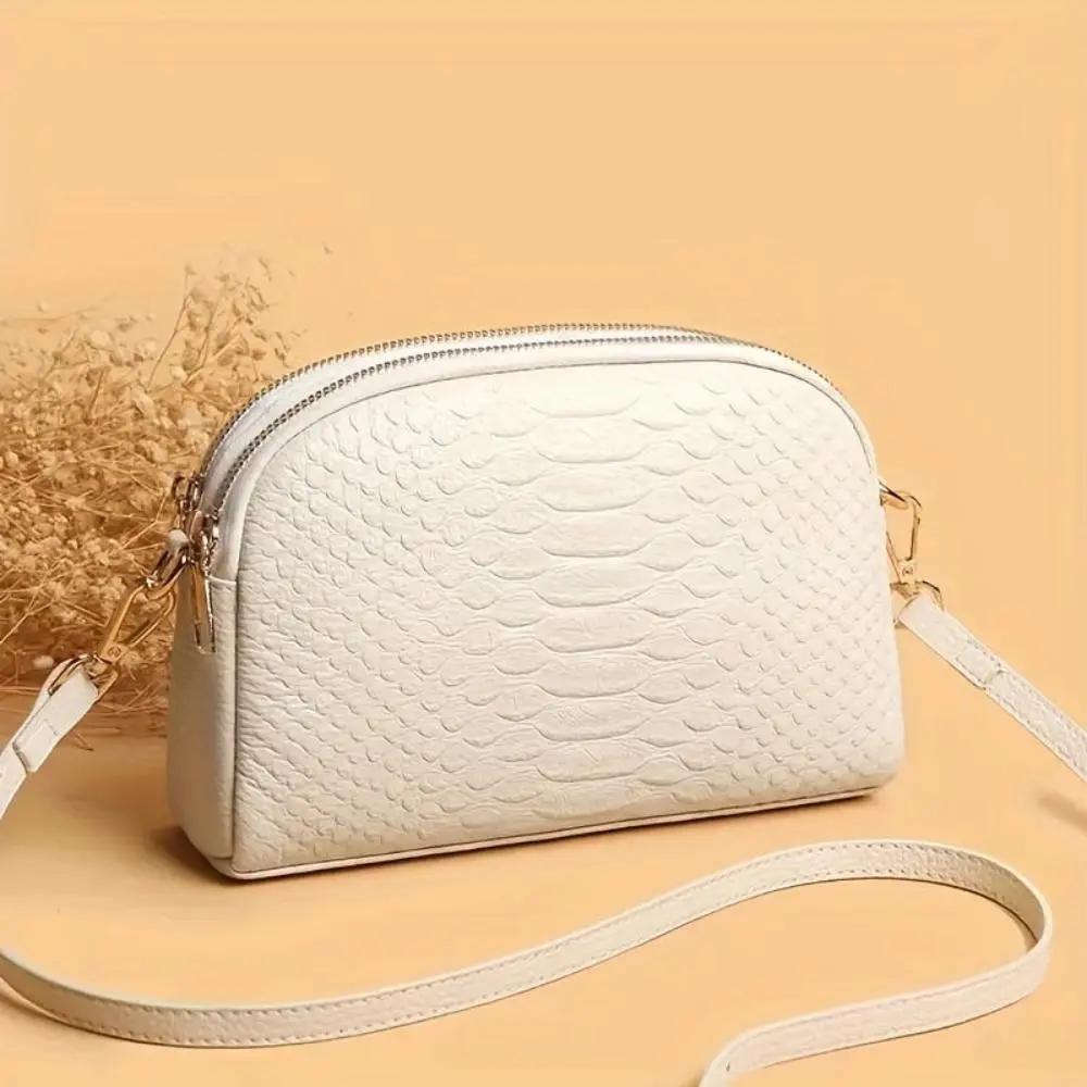 Sac à bandoulière noir Danoir Paris Cora, mini en simili cuir avec motif crocodile, design élégant et tendance.