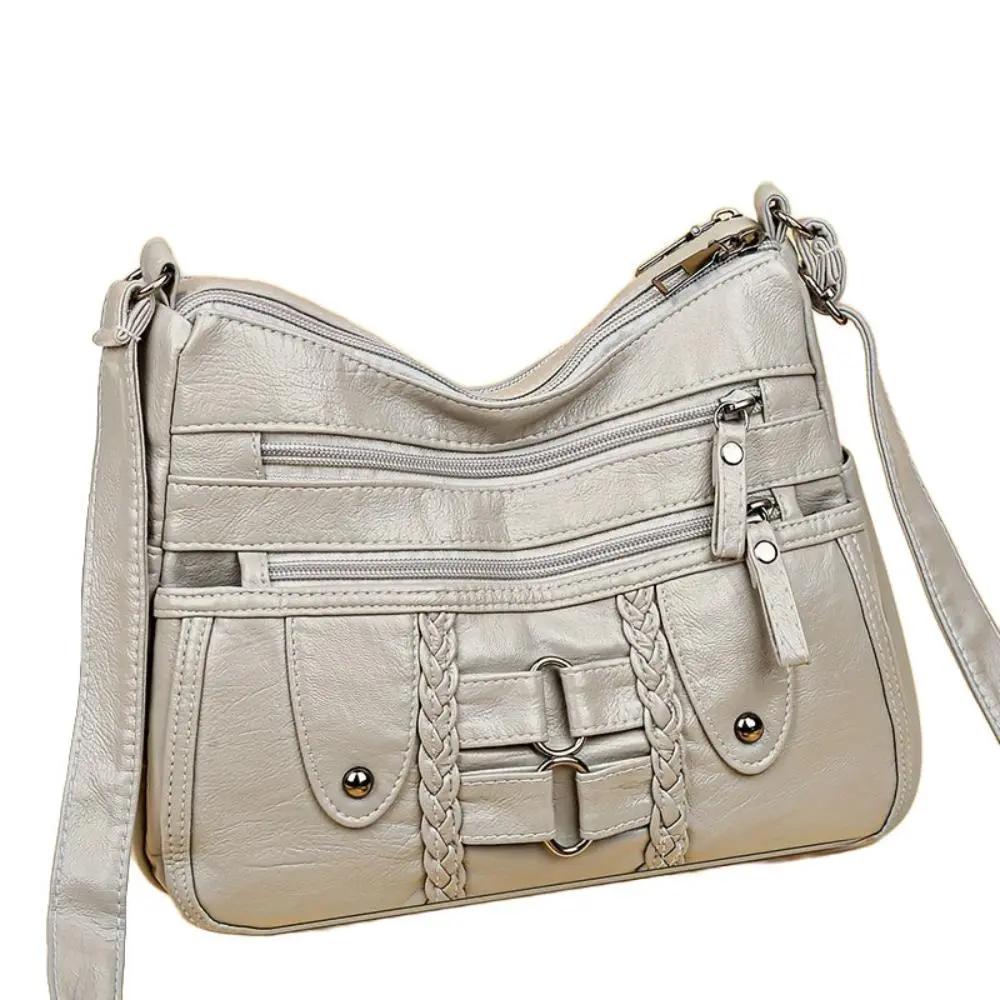 Sac bandoulière sécurisé Ivy de Danoir Paris, noir, avec compartiments visibles, idéal pour un rangement pratique et élégant.