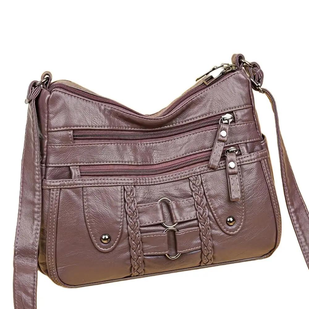 Sac bandoulière sécurisé Danoir Paris Ivy en cuir noir, avec fermeture robuste et design élégant.