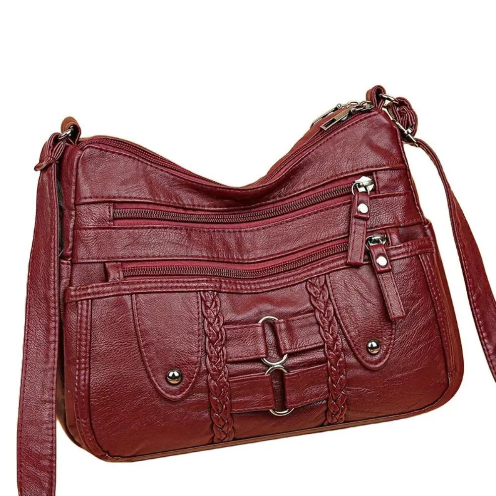 Sac bandoulière sécurisé Ivy de Danoir Paris, en cuir noir avec fermeture sécurisée et détails élégants.
