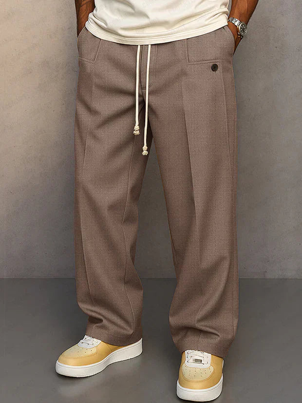 Pantalon élégant noir Danoir Paris Didier avec cordon ajustable, tissu fluide et coupe moderne, porté par un mannequin.