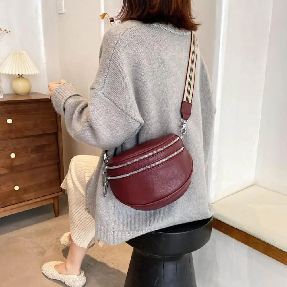 Sac à bandoulière noir Danoir Paris Mira, sac chic et polyvalent avec bandoulière réglable, visible en détail sur l'image.