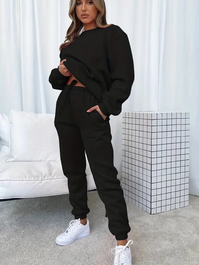 Ensemble d'hiver Cozy Brigitte de Danoir Paris, vêtement chaud avec pulls et pantalons en tissu doux et confortable.