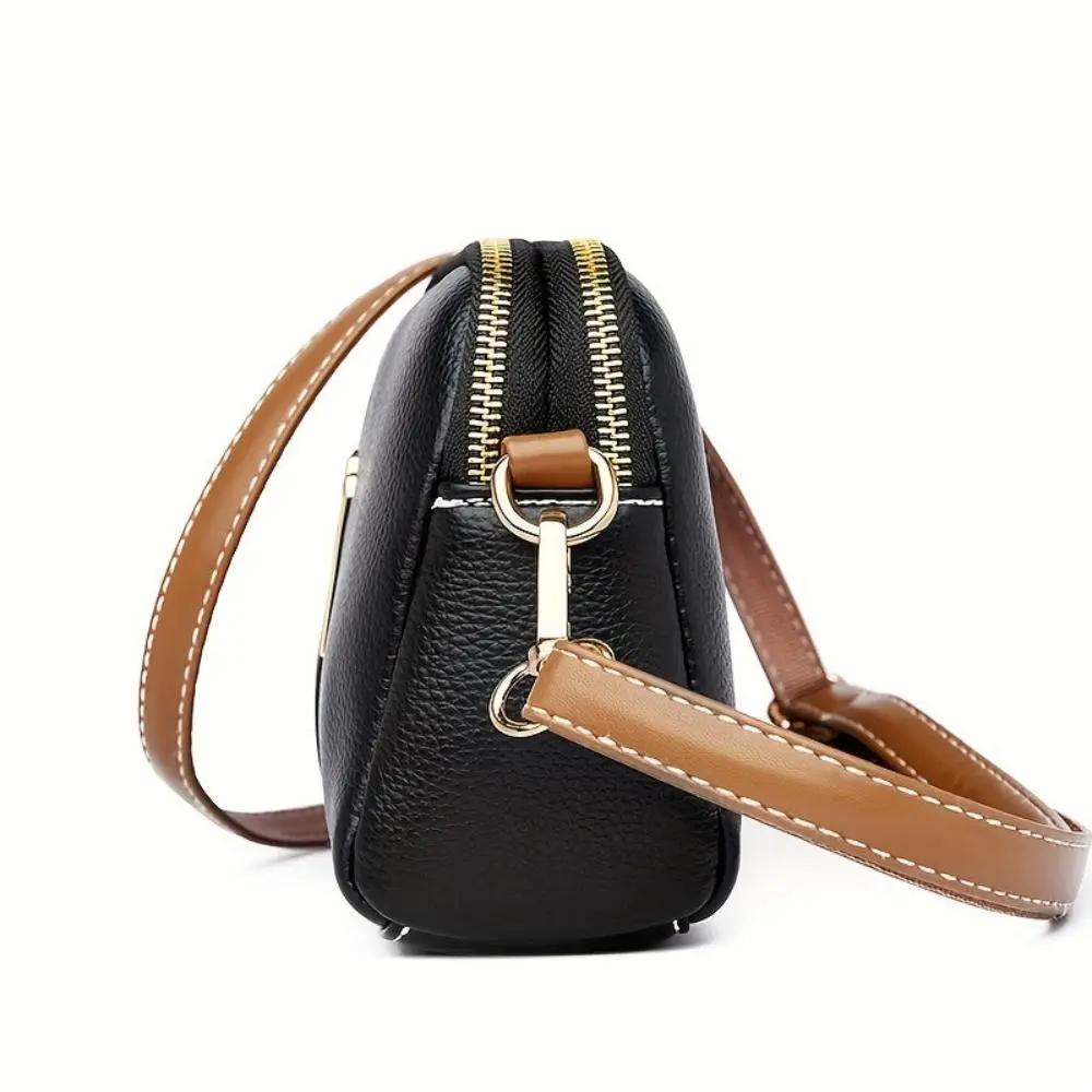 Sac bandoulière Sienna de Danoir Paris en noir, avec design élégant et pratique, tissu confortable et style moderne.