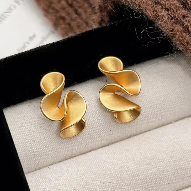 Boucles d'oreilles en argent et or 18K Danoir Paris, design élégant avec finition brillante et détails raffinés.