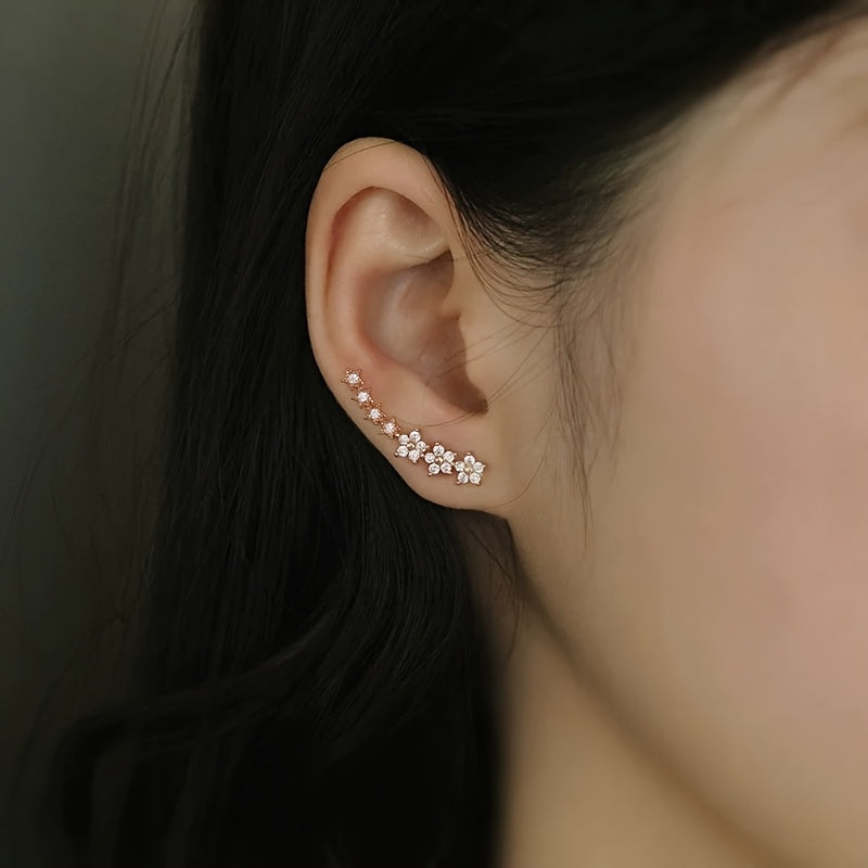 Boucles d'oreilles intemporelles en fleurs de Danoir Paris, design élégant avec motifs floraux en or rose.