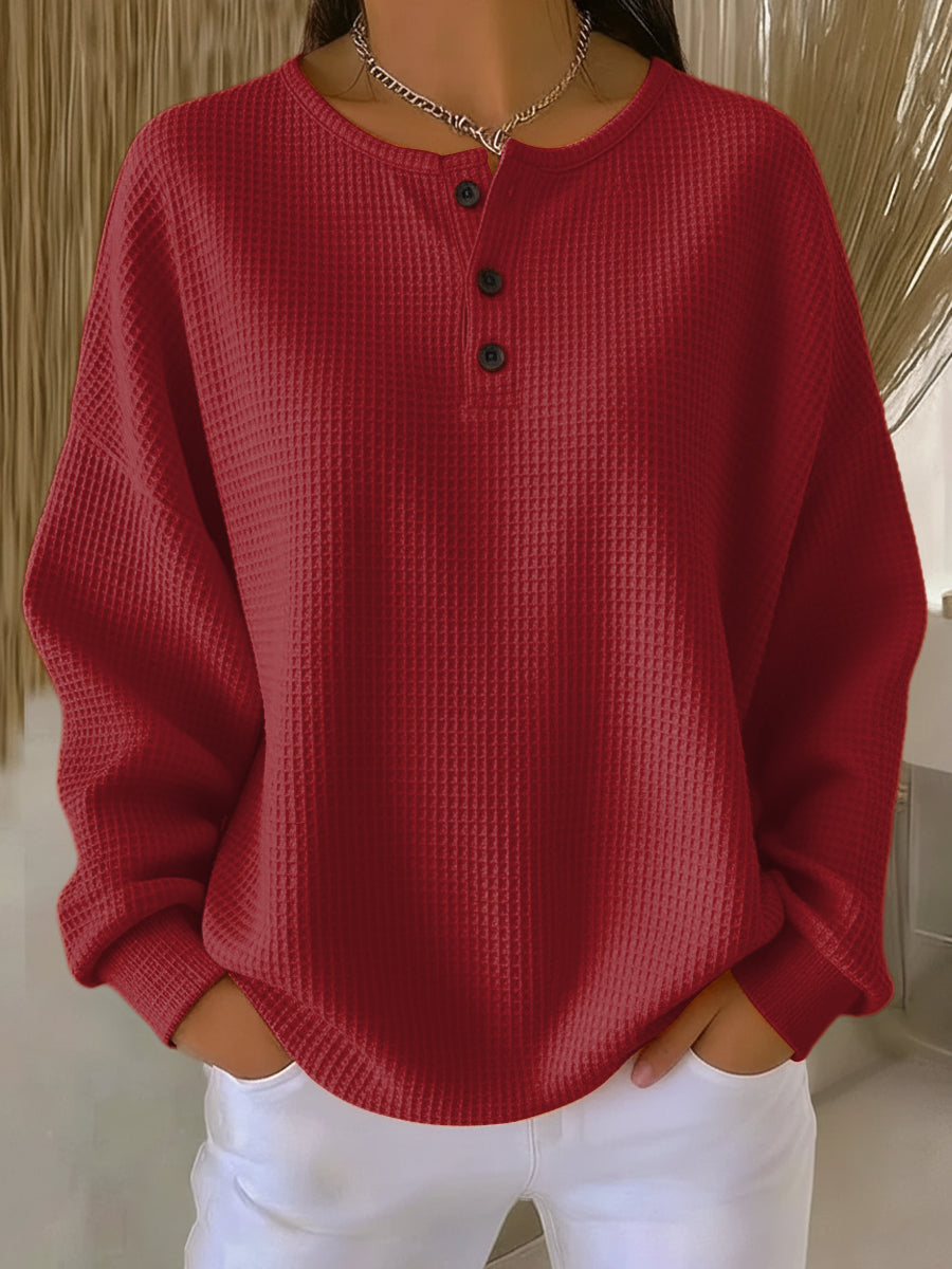 Sweatshirt orange Danoir Paris Adèle™ avec col élégant, porté par un mannequin. Look chic et confortable.