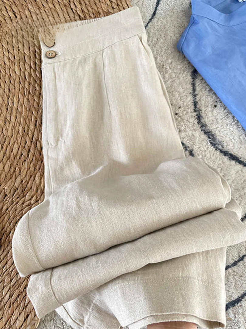 Pantalon en lin Maia de Danoir Paris, couleur abricot, avec coupe élégante et détails modernes visible sur l'image.