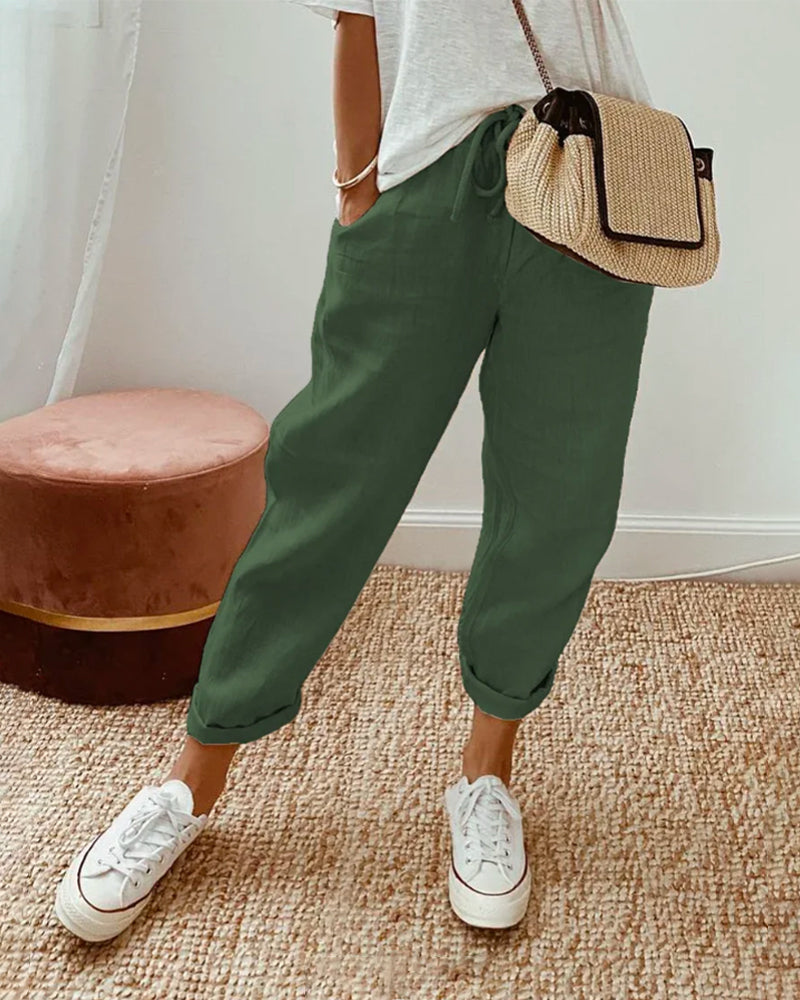 Pantalon fluide beige Lucie™ en mélange coton et lin de Danoir Paris, vue de face, avec ceinture et poches latérales.