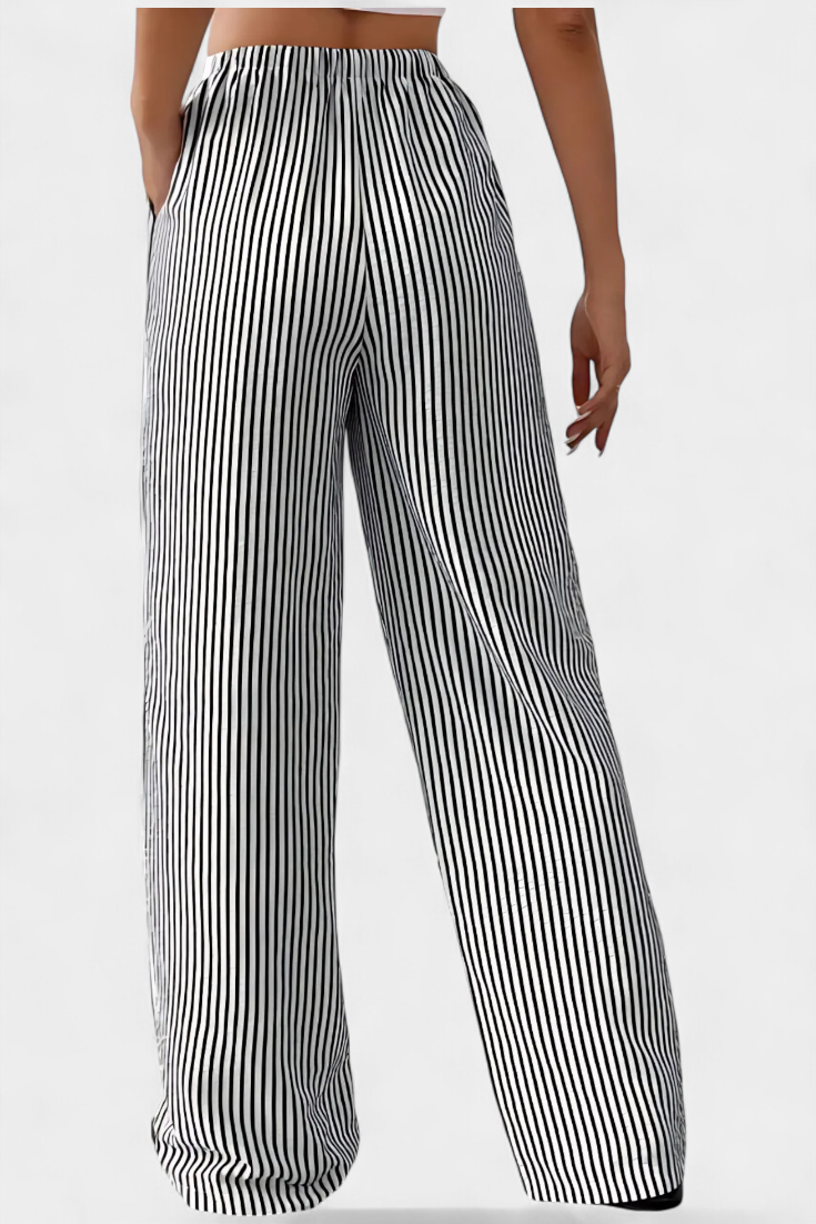 Pantalon Sabrina de Danoir Paris en tissu léger, coupe ajustée avec ceinture à la taille, couleur noire élégante.