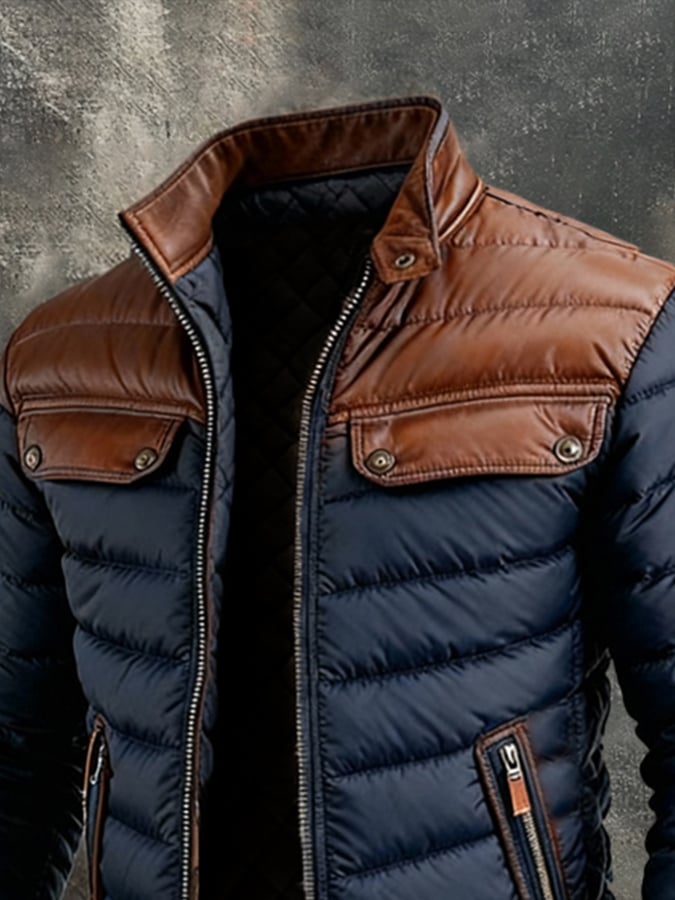 Veste matelassée bleu marine Danoir Paris avec empiècements en cuir, style élégant et chaud pour femme.