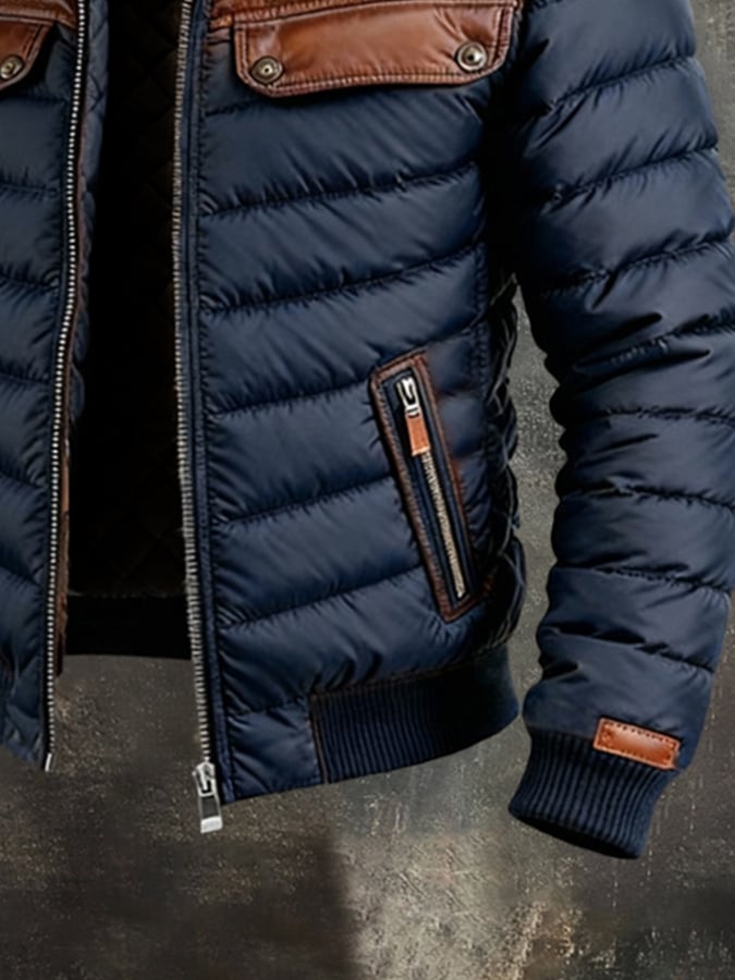 Veste matelassée bleue marine Danoir Paris avec empiècements en cuir, style élégant et chaud, pour femme ou homme.