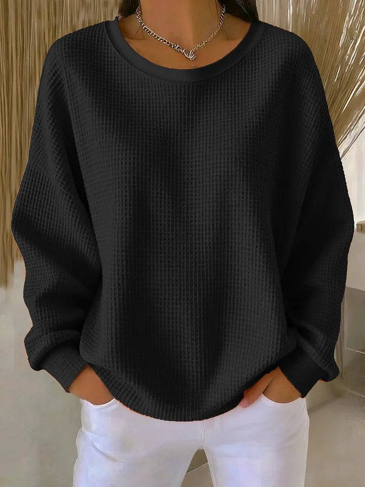 Pull classique LUCILLE Danoir Paris rose en coton, avec col rond et manches longues, porté par un mannequin.